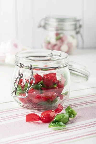 Sweet candies in glass jars Stock Picture