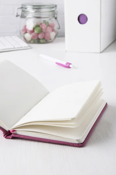 Pink ball pen with pink notebook Stock Picture