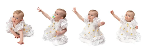 一个一岁的小女孩 拉着金发碧眼的手 穿着白色轻飘飘的衣服和白色紧身衣 不同的拍摄角度全身而退不同的感情背景是白色的 — 图库照片