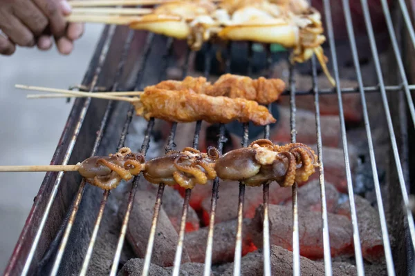 The Seafood Barbecue Of Grilled Squid On Charcoal Oven