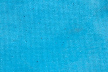 Eski mavi deri dokusunda benekler var..