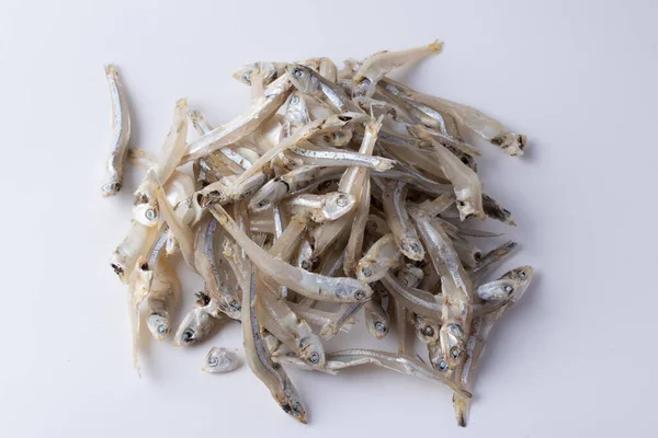 Dried anchovy on white background