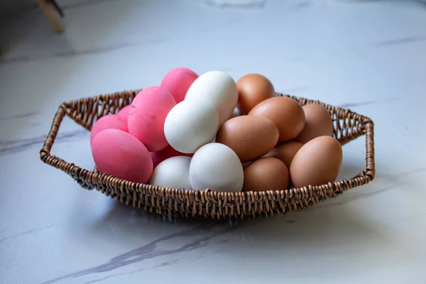 preserved egg Eggs and salted eggs are combined in a wicker basket.