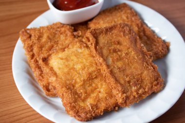 Domatesli çırpılmış balık filetosu