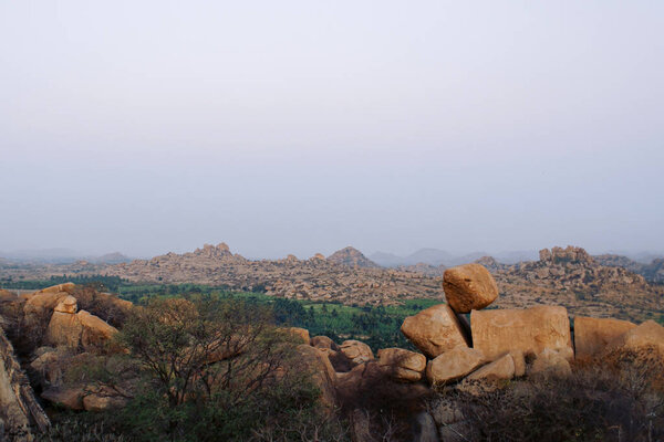 Sunset on the background of rocky terrain