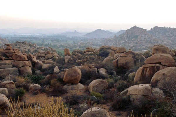 Sunset on the background of rocky terrain