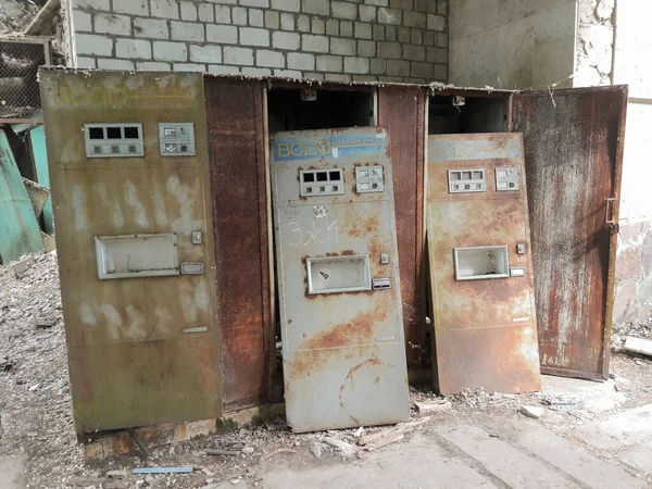 Several old broken vending machines for selling soda water in Pripyat, Ukraine. Abandoned Exclusion Zone