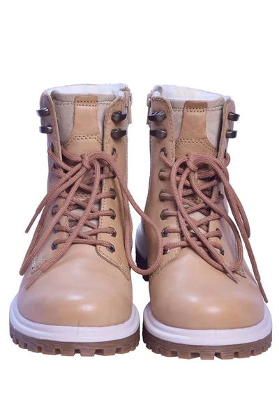 Two beige winter boots stand toes first on a white clipping background. — Stock Photo, Image