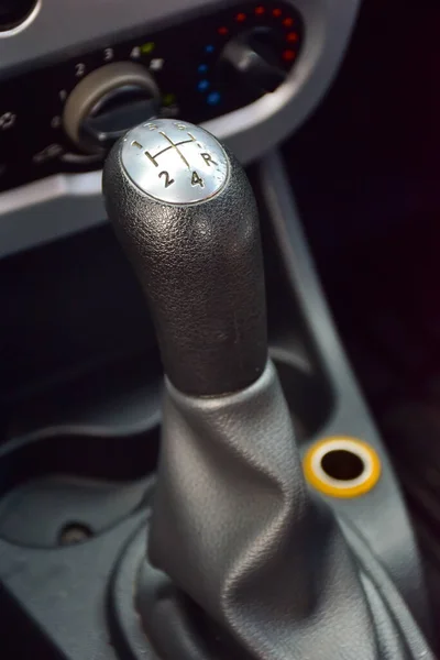 The handle of a manual transmission of a car with engraved numbers and a diagram of the handle movement Stock Image