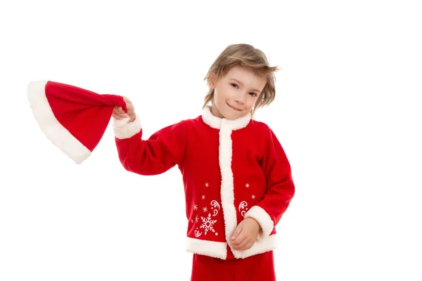 一个穿得像圣诞老人的小男孩一边挥动着帽子 一边笑着 在独立的白色背景下在工作室拍摄的照片 — 图库照片
