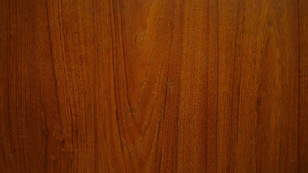 Wood grain texture for making Background or Wallpaper. Wood grain pattern, red and black tone. Red teak wood pattern.