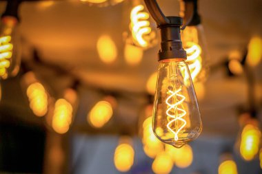 garland of incandescent lamps with blurred background. background, wallpaper