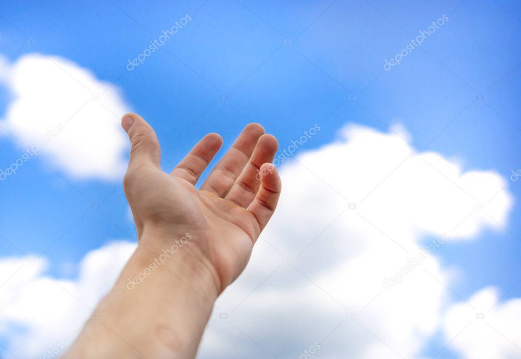 hand reaching for sky. palm asks for help on sky background, copy space. Concept of religion, freedom, hope, help, dream, business.