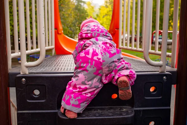 Adorable Kid Winter Overalls Climbs Steps Children Slide Playground Funny — Stock Photo, Image