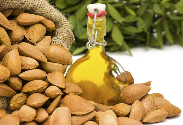 Almonds in a hessian sack with oil — Stock Photo, Image