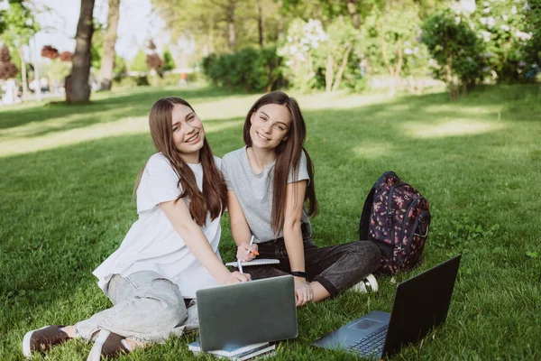 Two Female Students Sitting Park Grass Books Laptops Studying Preparing — Stock Photo, Image