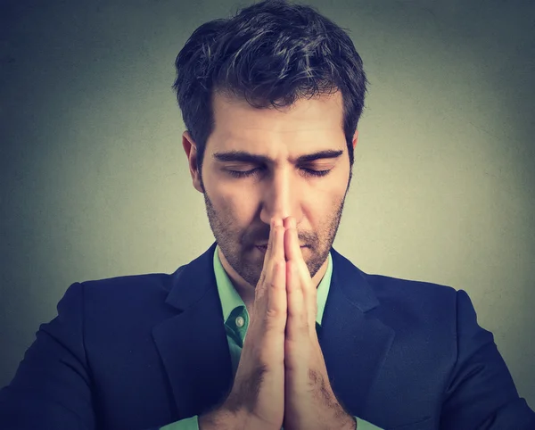 Closeup portrait of young desperate man isolated on gray wall background — Stock Photo, Image