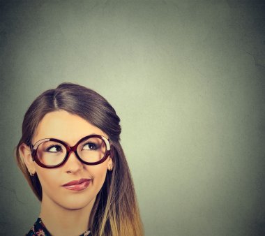 unny confused skeptical woman in glasses thinking planning looking up  clipart