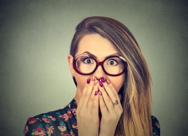 Concerned scared woman in glasses 