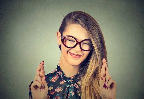 Hopeful beautiful woman crossing her fingers, eyes closed, hoping, asking best — ストック写真