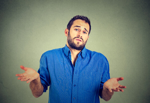 man shrugging shoulders who cares so what I don't know gesture