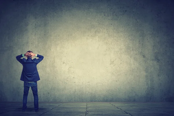 Full length of business man facing the wal — Stock Photo, Image