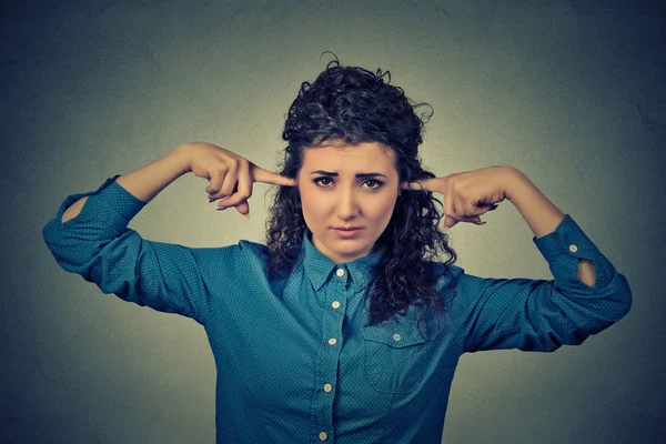 Closeup portrait upset woman plugging ears with fingers doesn't want to listen — 스톡 사진