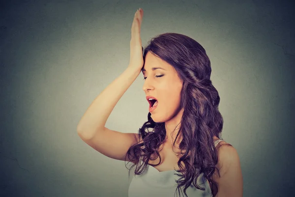 Regrets wrong doing. Woman, slapping hand on head having duh moment — Stock Photo, Image