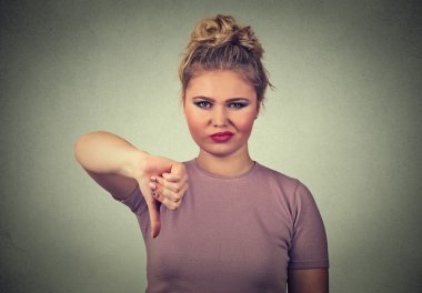 displeased angry pissed off woman annoyed giving thumbs down gesture clipart