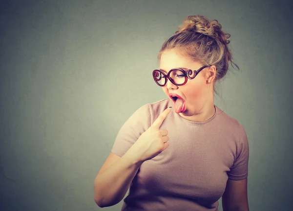 Woman fed up sticking her finger in throat showing she is about to throw up — Stockfoto