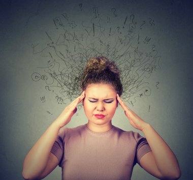woman with worried stressed face expression and brain melting into lines question marks. 