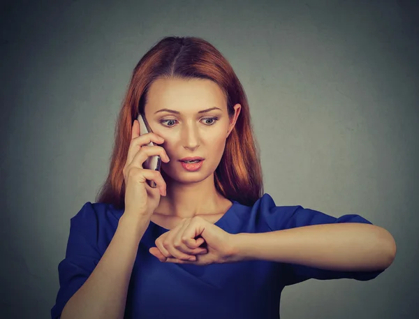 Stressed surprised business woman looking at wrist watch, running late — Stock Photo, Image