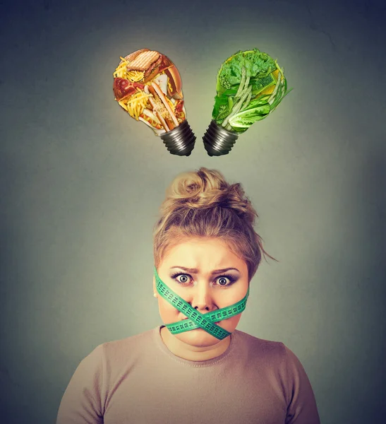 Diet restriction stress. Frustrated woman with measuring tape around her mouth — Stock Photo, Image