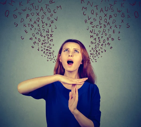 Woman showing time out gesture screaming to stop alphabet letters coming out of mouth — ストック写真