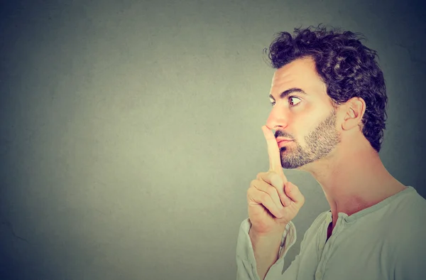 Silence quiet gesture. Side profile man making hush sign — Stock Photo, Image