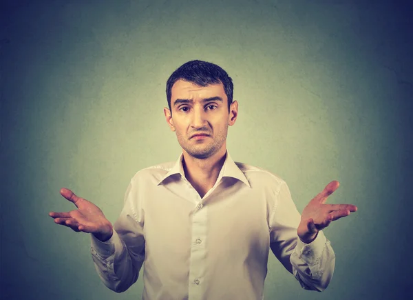 Ignorance and arrogance. Man shrugging shoulders so what I don't know gesture — Stock Photo, Image