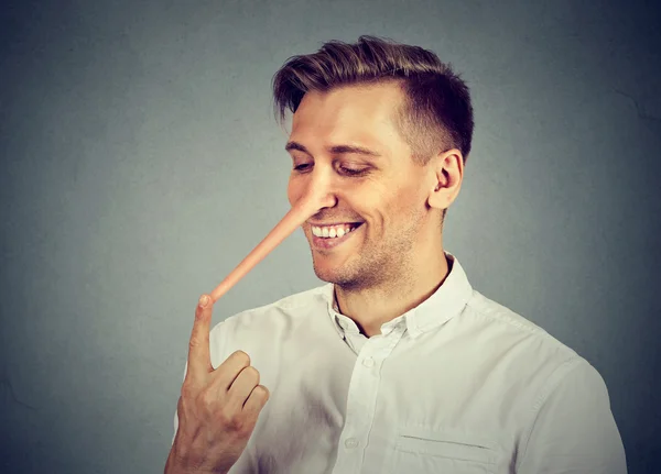 Man with long nose. Liar concept — Stock Photo, Image