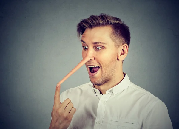 Man with long nose. Liar concept. — Stock Photo, Image