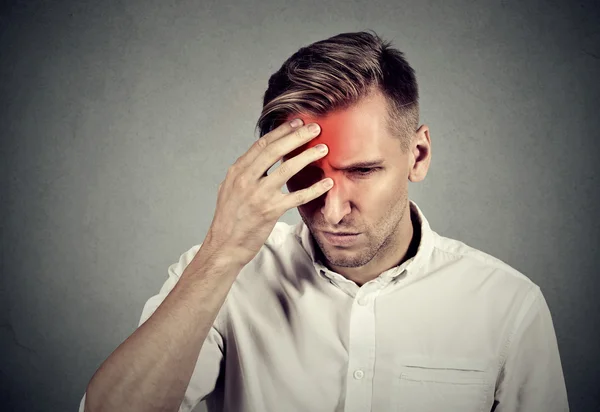 Stressed young man with headache — Stock Photo, Image