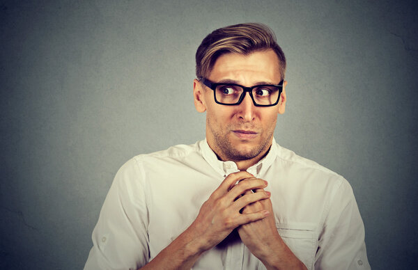 Nervous stressed man feels awkward anxiously craving something 