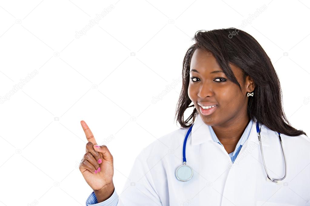 Female doctor pointing at copy space