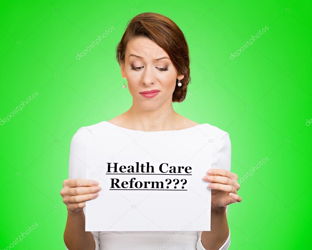 Skeptical woman holding sign health care reform? 