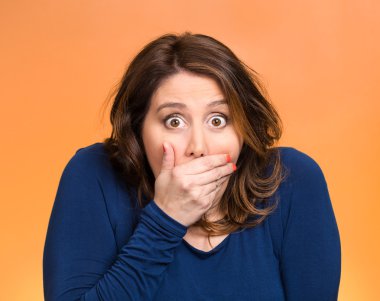Shocked young woman, covering her mouth clipart