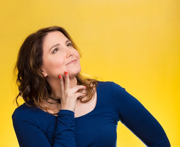 Happy, middle aged woman looking upwards daydreaming — Stock Photo, Image