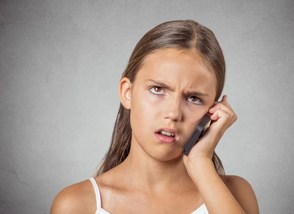 Angry teenager talking on cell phone — Stock Photo, Image