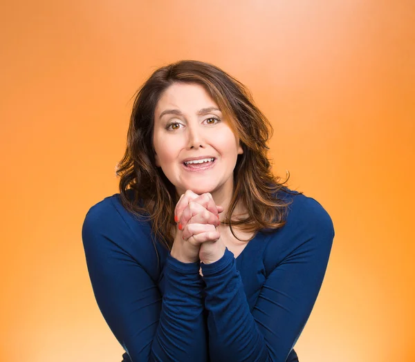 Woman gesturing with clasped hands, pretty please with sugar on top — Stock Photo, Image