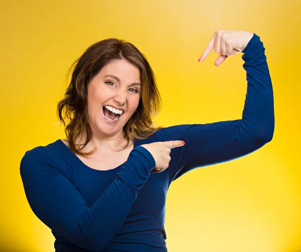 Woman flexing muscles showing, displaying her strength — Stock Photo, Image