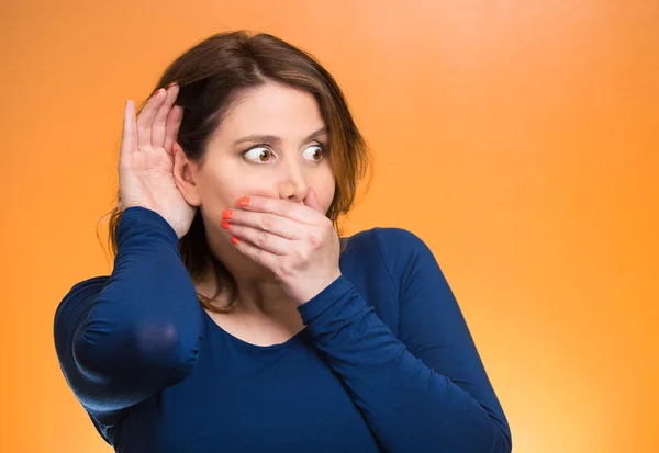 Nosy woman carefully listening to someone's conversation — Stock Photo, Image