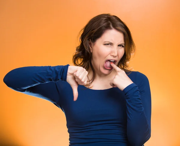 Woman, giving thumb down, finger in mouth gesture — Stock Photo, Image