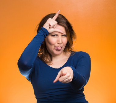 Mad pissed off woman, showing loser sign